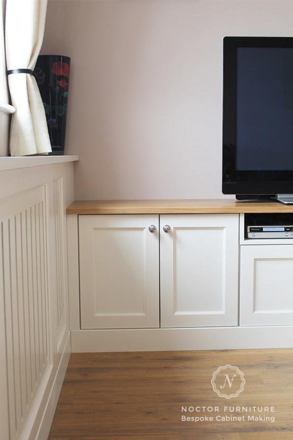 Close-up of cream coloured bespoke living room cabinets 