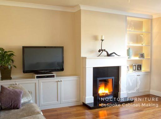 Bespoke living room with cabinets and fireplace