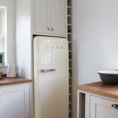 Smeg fridge installed in a handcrafted kitchen